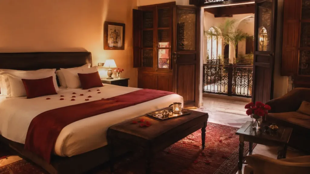 Romantic hotel room in Marrakech with Moroccan decor, rose petals, and warm lighting