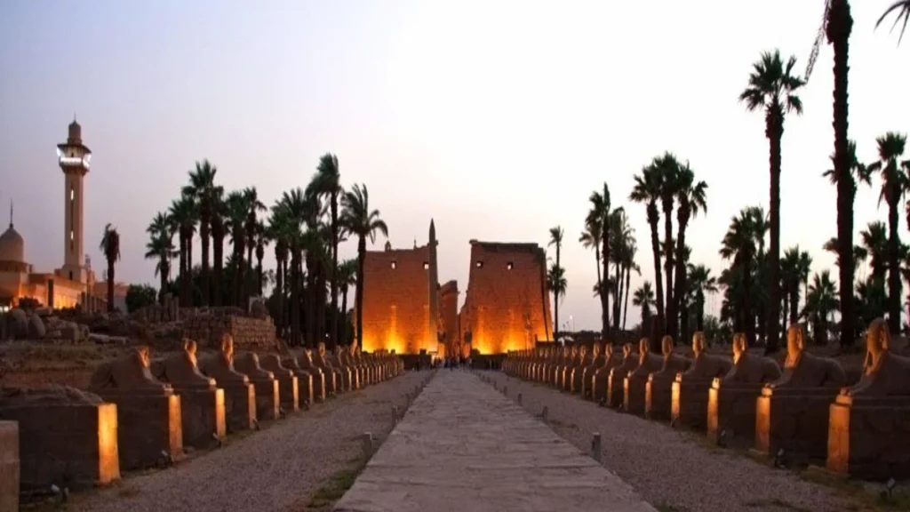 Luxor Temple Avenue of Sphinxes glowing at night during an Egypt honeymoon itinerary