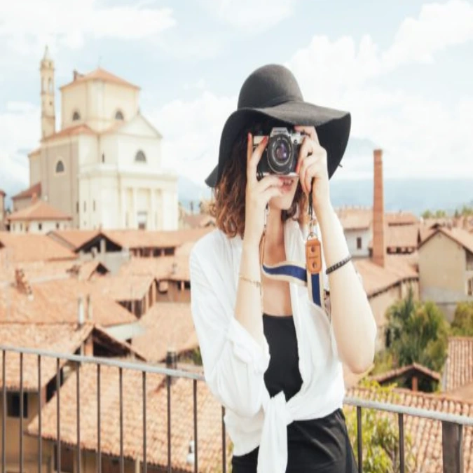 Traveler taking better vacation photos during a scenic trip.