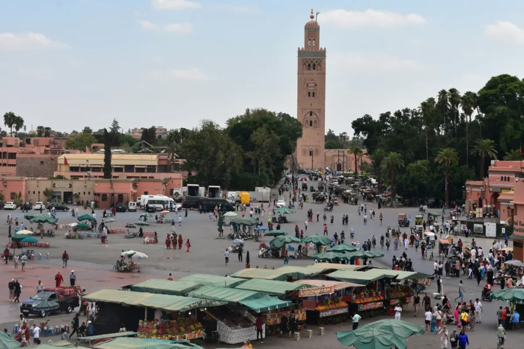Jemaa el-Fna square in Marrakech with Koutoubia Mosque in the background